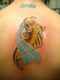 Japanese koi fish on spine tatto